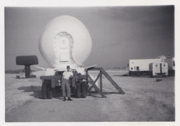 Posing with a radar installation.