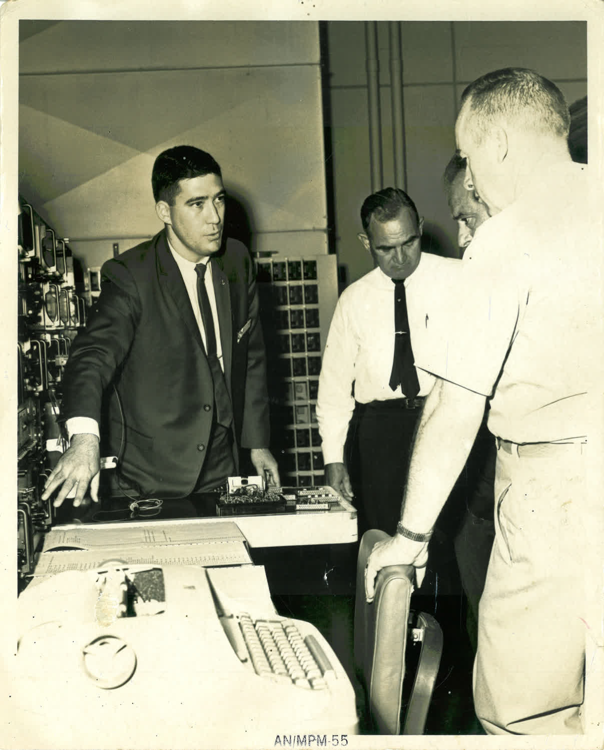 My father demos testing equipment for some high-ranking Army officials