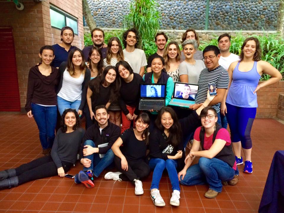 Zach with students and staff